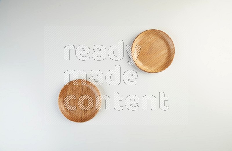 Wooden bowl and plate on white background