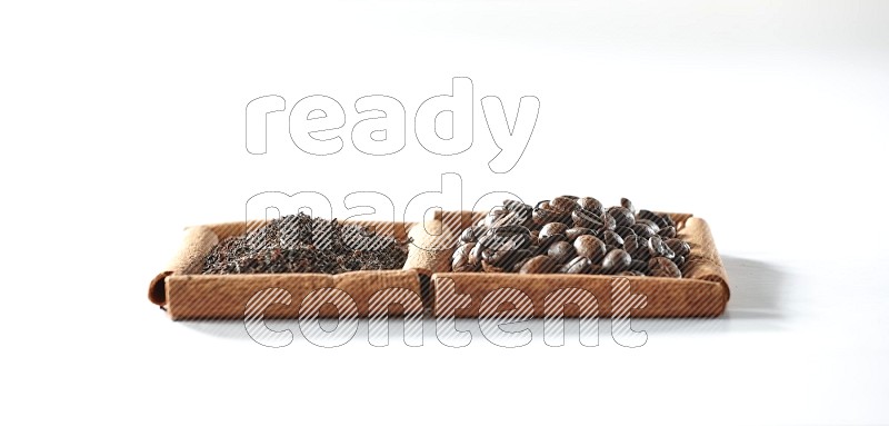 2 squares of cinnamon sticks full of coffee beans and black tea on white flooring