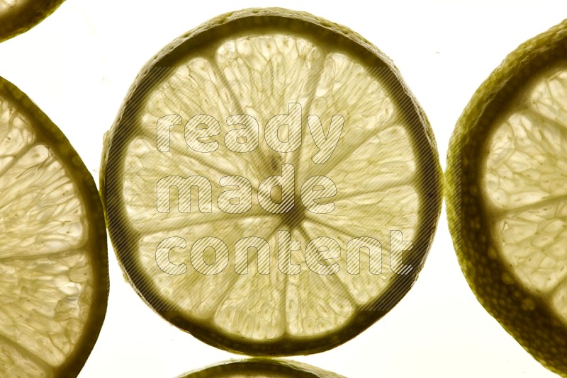 Lemon slices on illuminated white background