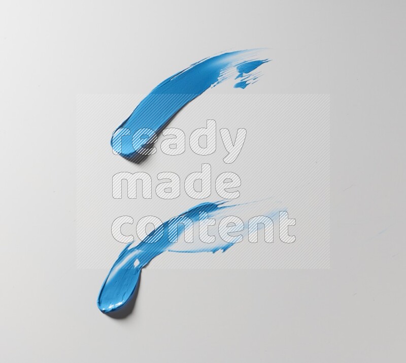 Blue curved painting knife strokes on white background