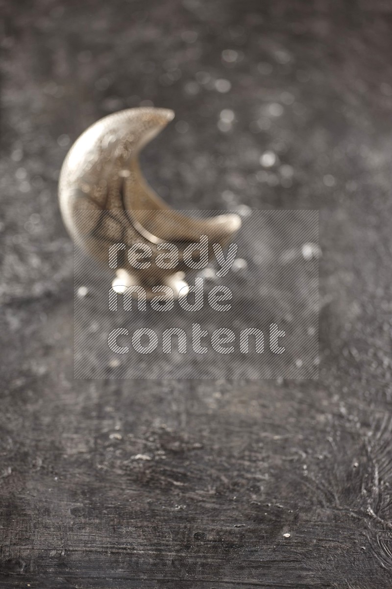 An out of focus lantern on textured black background