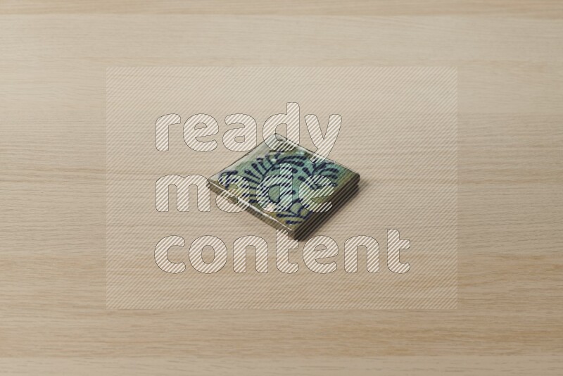 A decorative coaster on light wooden background