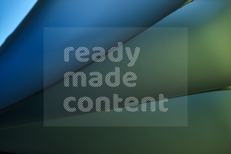 An abstract art piece displaying smooth curves in cold gradients created by colored light