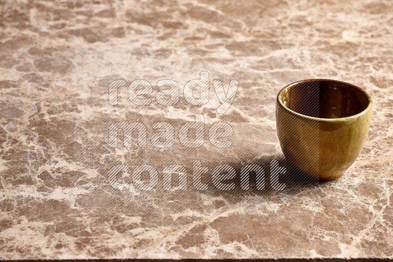 Multicolored Pottery Cup on Beige Marble Flooring, 45 degrees