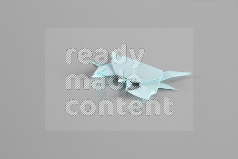 Origami animals on grey background