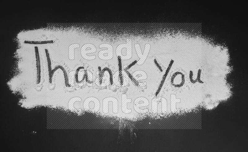 A sentence written with powder on black background