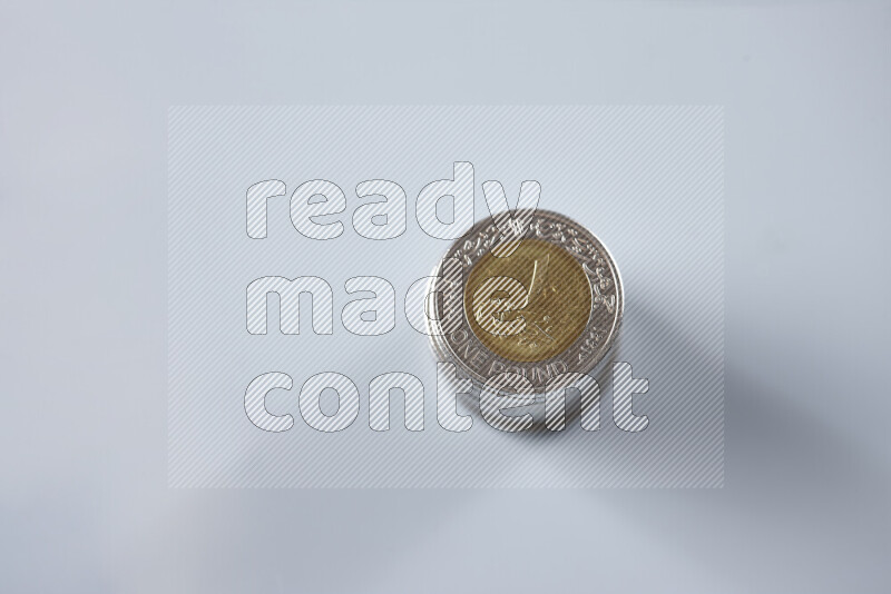 Stack Egyptian one pound coins on grey background