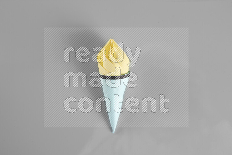 Origami ice cream on grey background