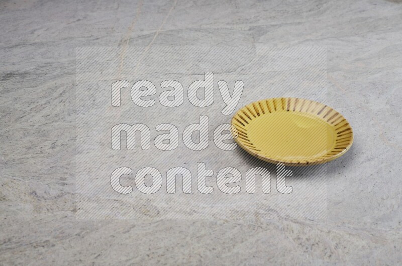 Multicolored Pottery Plate On Grey Marble Flooring