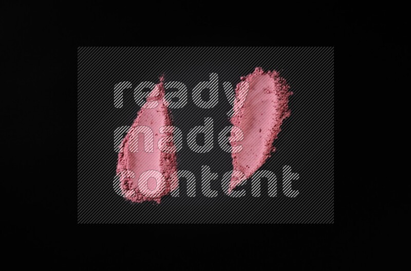 Red powder strokes on black background