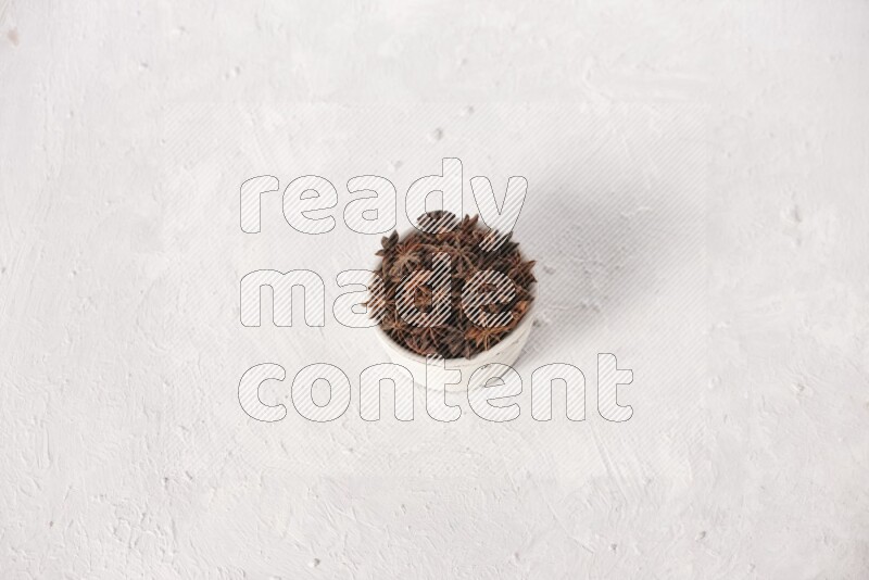 Star Anise in a white bowl on white background
