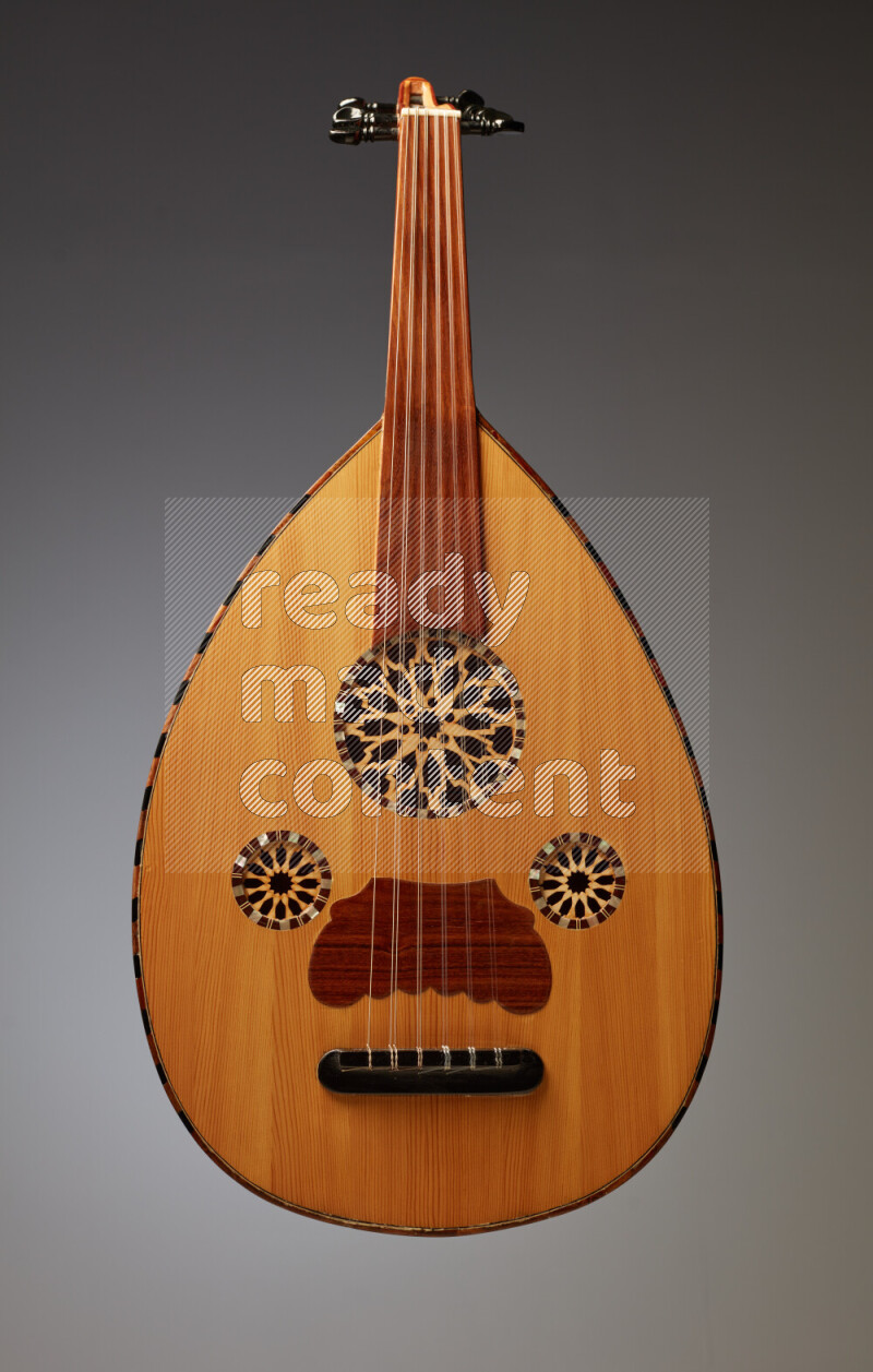 a wooden brown Oud on a gray background