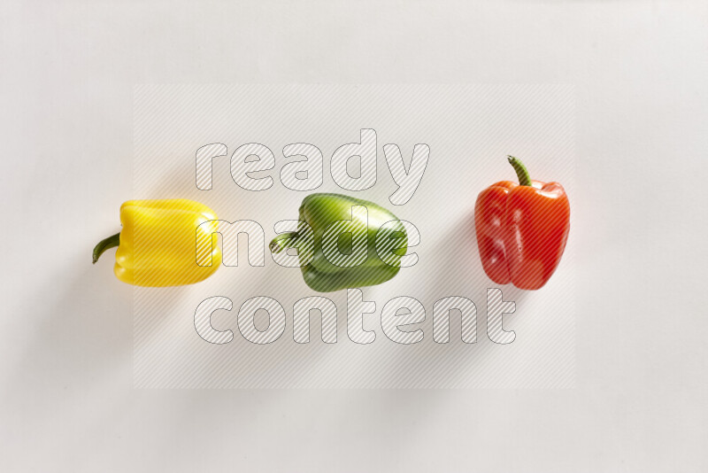 Assorted bell peppers on white background