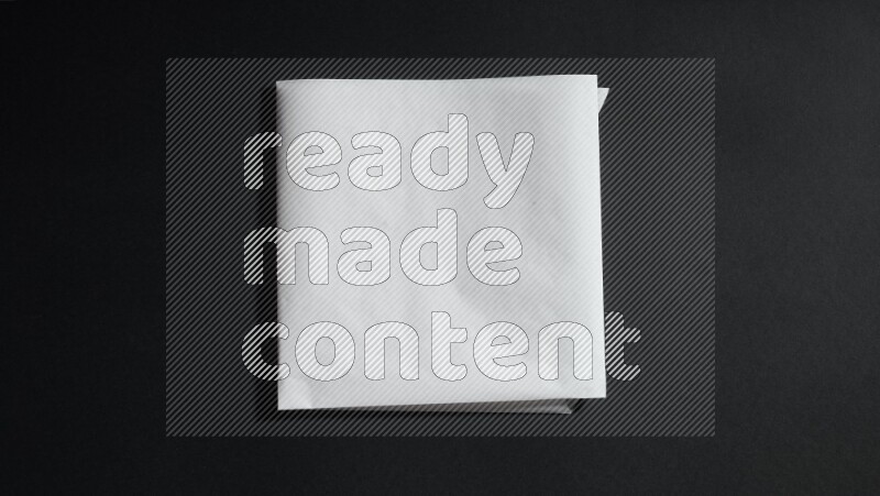 White paper sheet on black background