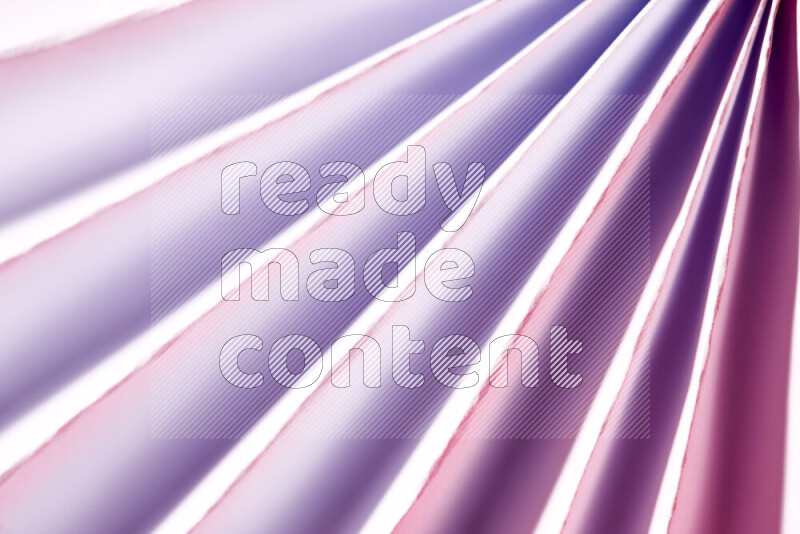 An image presenting an abstract paper pattern of lines in white and purple tones