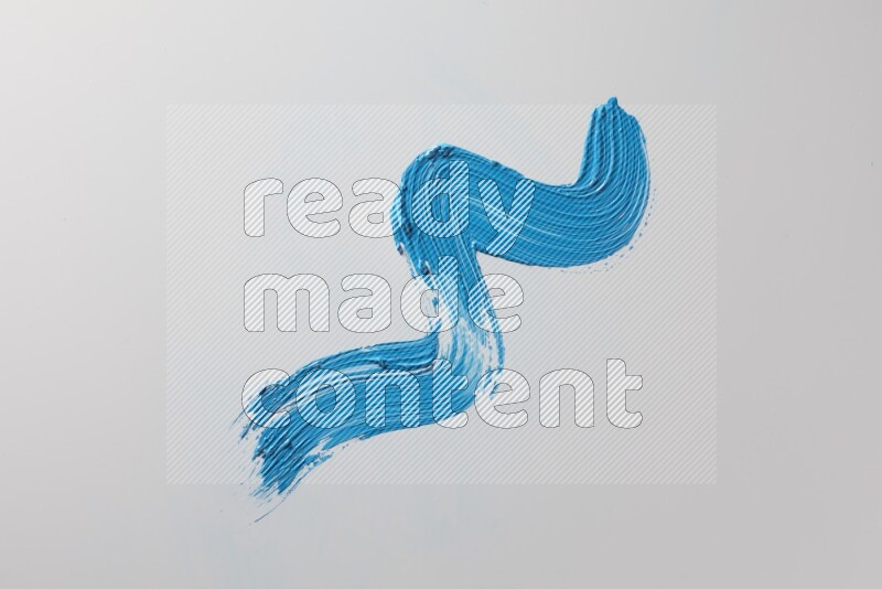 A single blue zigzag brush stroke on a white background
