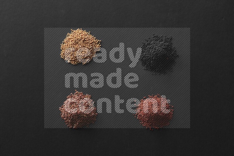 حبة البركة و حبوب الخردل وحبوب الكتان وحب الرشاد علي خلفية سوداء