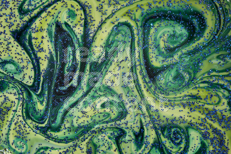 لقطة مقربة لبريق أزرق متلألئ منتشر على خلفية من اللون الأزرق والأخضر في حركات دائرية