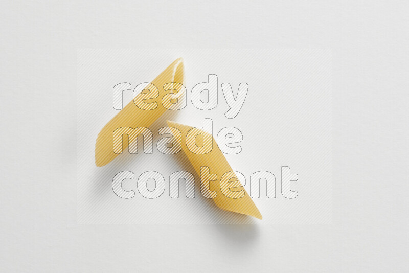 Penne pasta on white background