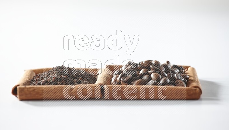 2 squares of cinnamon sticks full of coffee beans and black tea on white flooring