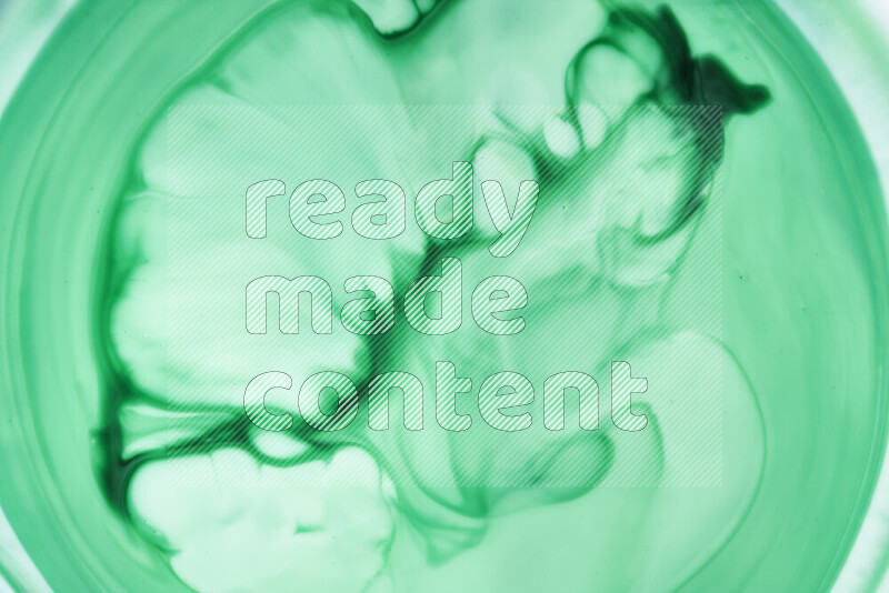 A close-up of abstract swirling patterns in green gradients