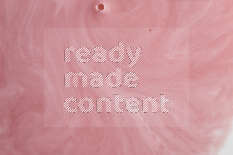 A close-up of abstract swirling patterns in red and white