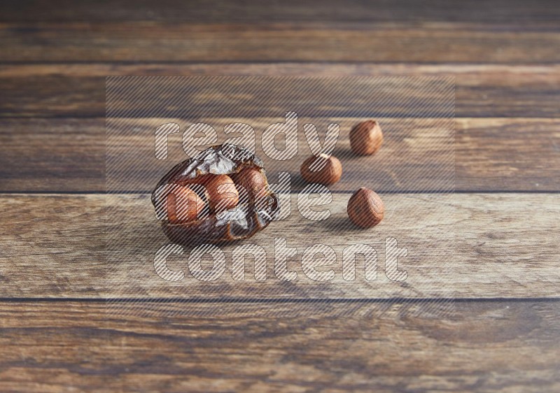 hazelnut stuffed madjoul date on a wooden background