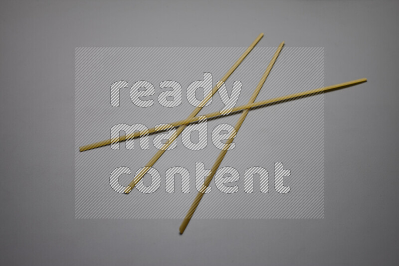 Linguini pasta on grey background