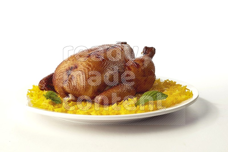 yellow  basmati Rice with  whole roasted chicken on a white rounded plate direct on white background