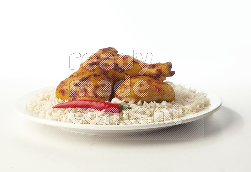 white  basmati Rice with  kabsa chicken pieces  on a white rounded plate direct on white background