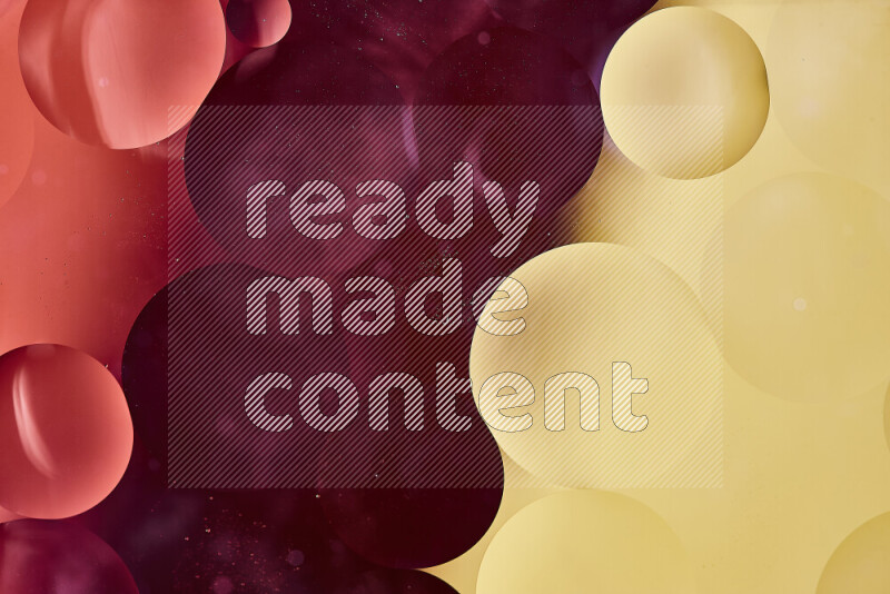 لقطات مقربة لفقاعات من الزيت على سطح الماء باللون الأحمر والأصفر