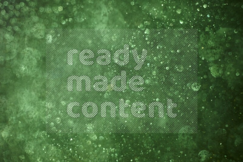 Green glitter powder isolated on black background