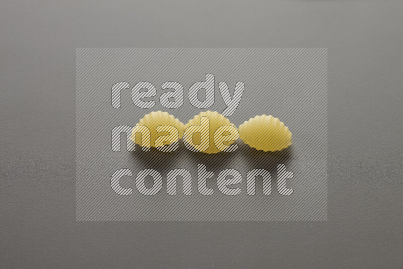 Shells pasta on grey background