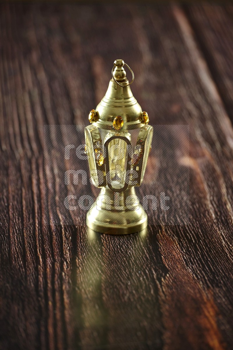 A lantern placed on a wooden background