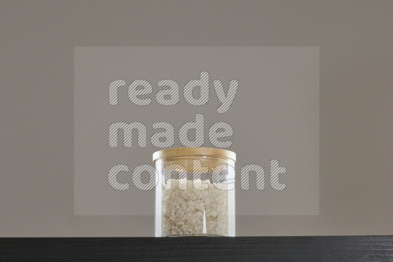 Salt in a glass jar on black background