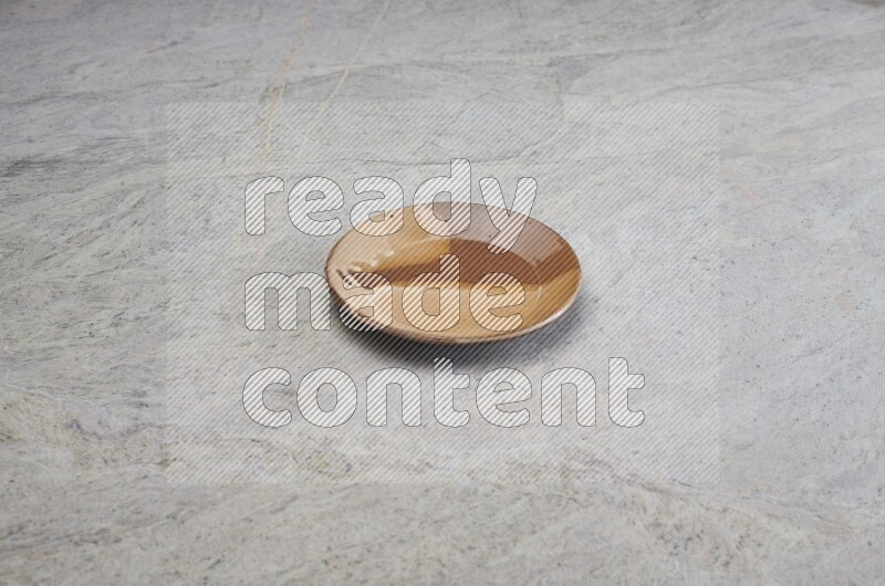 Multicolored Pottery Plate On Grey Marble Flooring