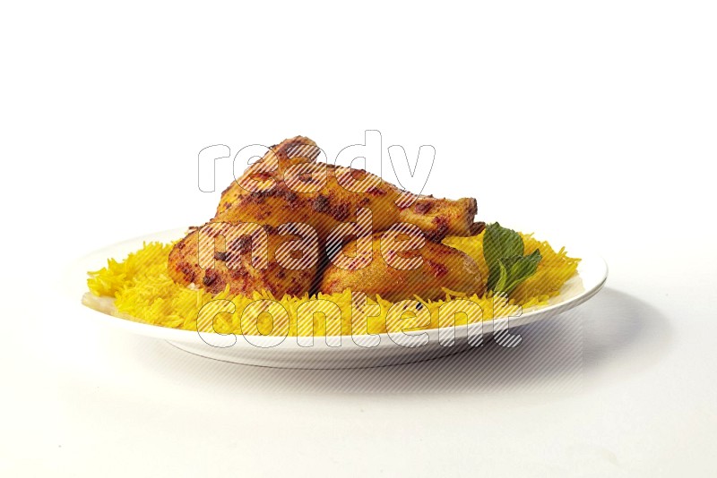 yellow basmati Rice with kabsa chicken pieces on a white rounded plate direct on white background