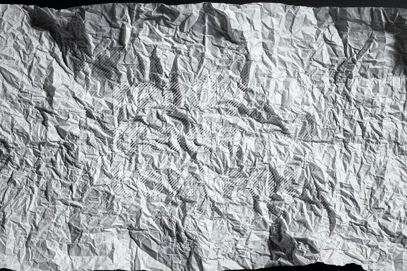 White paper sheet on black background