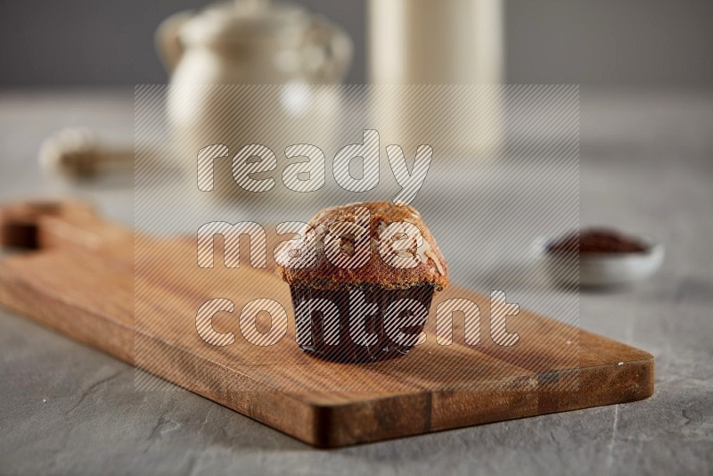 Peanut cupcake on a wooden board