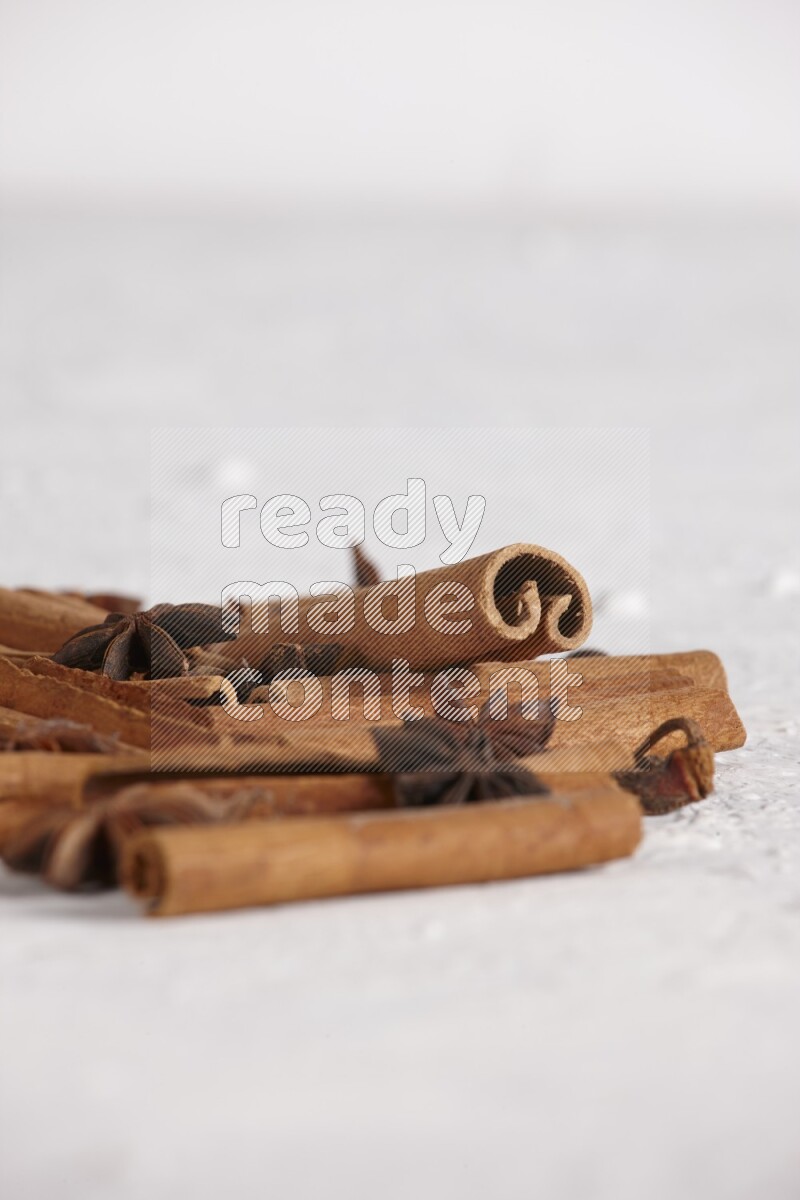 cinnamon sticks with star anise on white background