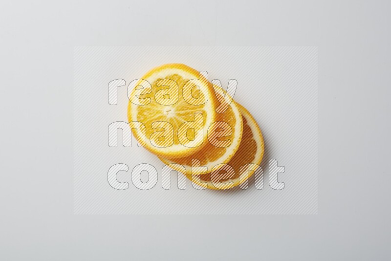 Three orange slices on a white background