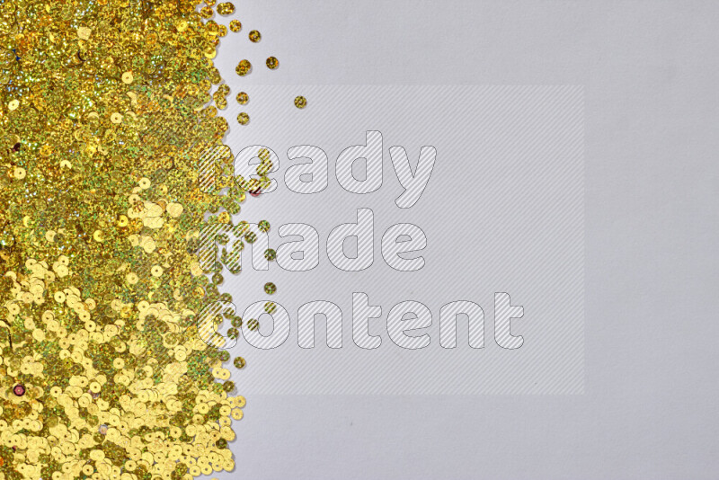 Multicolored flat sequins on grey background