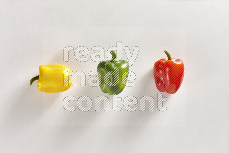 Assorted bell peppers on white background