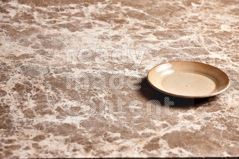 Beige Pottery Plate on Beige Marble Flooring, 45 degrees