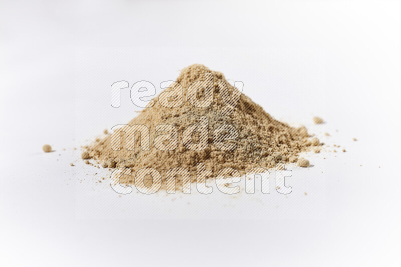 A bunch of ground ginger powder on white background