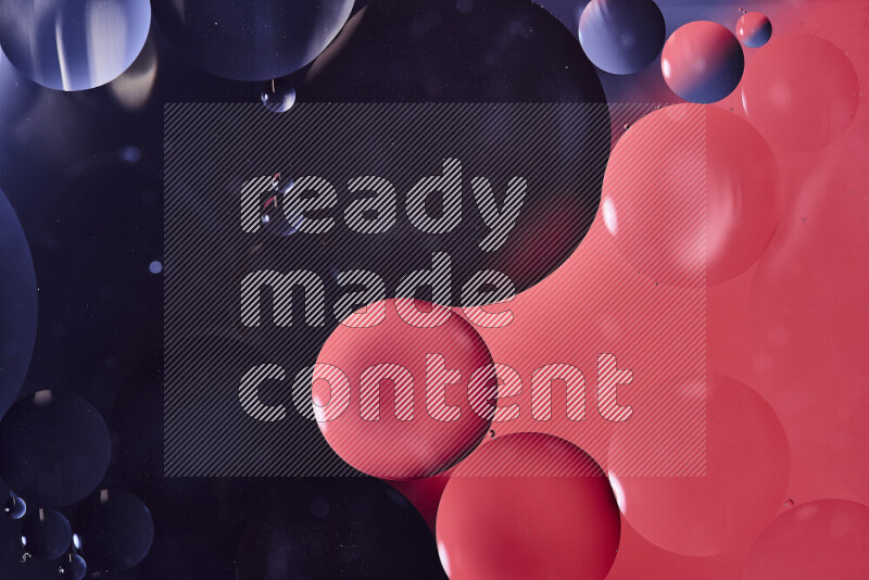 Close-ups of abstract oil bubbles on water surface in shades of black and red