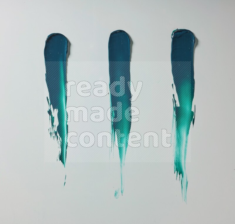 Turquoise painting knife strokes on white background