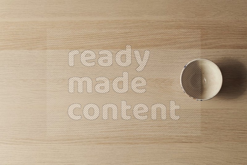 Top View Shot Of A White Pottery Bowl on Oak Wooden Flooring