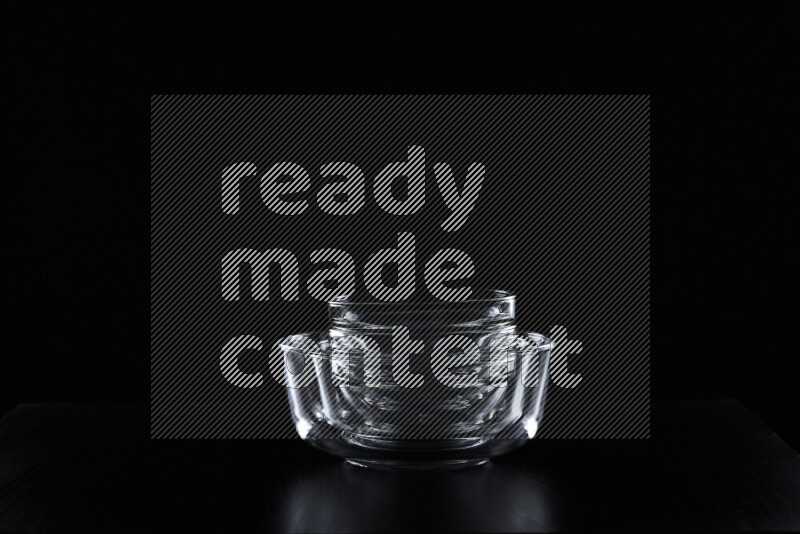 Glassware with rim light against black background