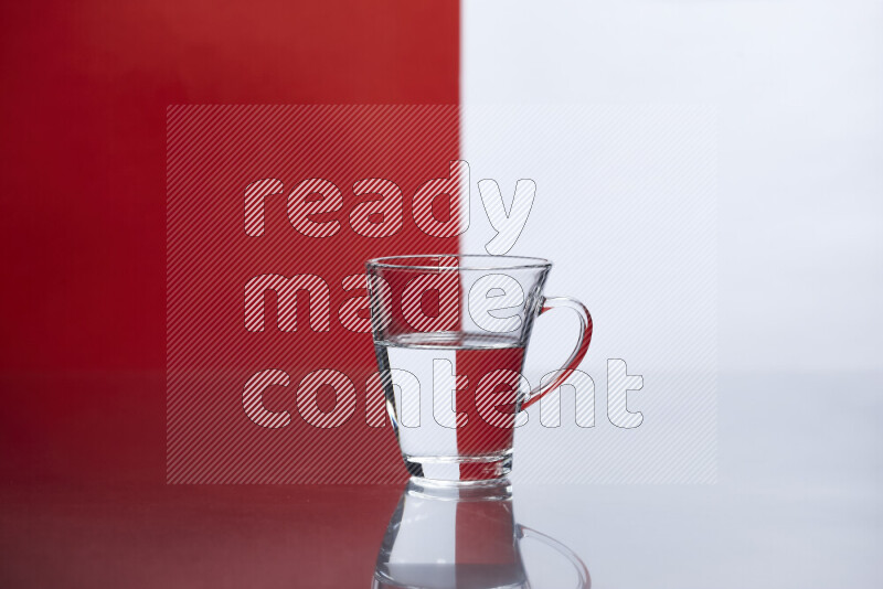 The image features a clear glassware filled with water, set against white and red background